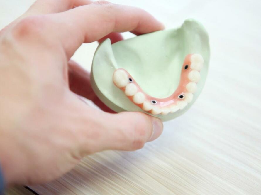 person holding teeth